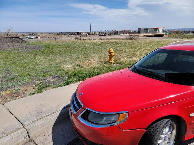 car in front of hydrant 