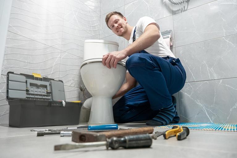 plumber with toilet.jpg